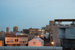 Lovely shot of city apartment buildings from a rooftop in the evening, just after sunset.