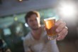 © wavebreak3 - Close up of man holding beer glass