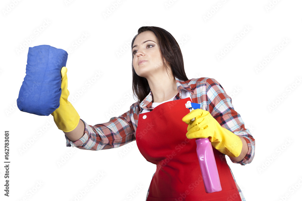 Housewife in apron and rubber gloves.Daily cleaning of the house using ...