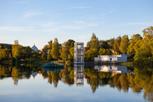 A Traditional Cottage And Jumpring Tower Stands By The Lakeside In Hedemora, Sweden