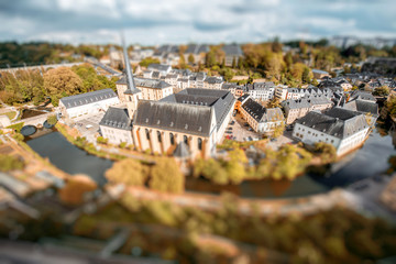 Canvas Print - Top view on the Grund district with saint Johns church and Neumunster abbey in Luxembourg city. Tilt-shift image technic