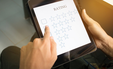 Wall Mural - blurred of customer survey checking in online survey, rating feedback on smart phone with multiple-c