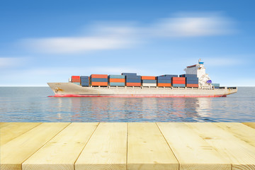 Cargo ship and cargo container in sea with clear sky background.