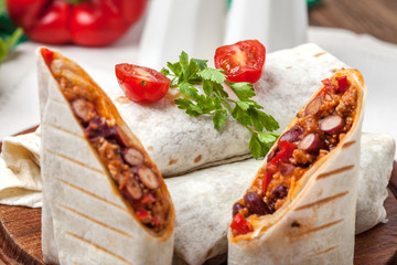 Canvas Print - Burritos filled wiht minced meat, bean and vegetables.