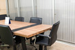 © ichz - black leather office chair and table in the meeting room in selective focus.