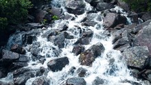 Rushing Foamy Water Of The Rocky Waterfall