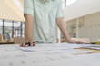 © I Believe I Can Fly - Engineer sketching architectural project on blueprint, engineering concept, architectural concept