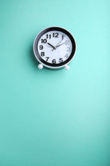 Wall Mural - Black clock on mint background