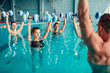 © Nomad_Soul - Women aqua aerobics traninig with dumbbells
