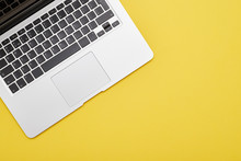 Modern Laptop Keyboard On Yellow Background