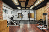 Fototapeta Zwierzęta - Interior view of a gym with equipment.