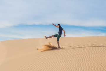 Man kicks the sand, annoyance, aggression