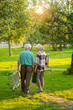 © DenisProduction.com - Elderly gardeners couple, back view. Old man and woman, summer. Life away from bustle.