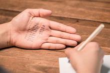 People Cheating On Test By Writing Answer On Hand