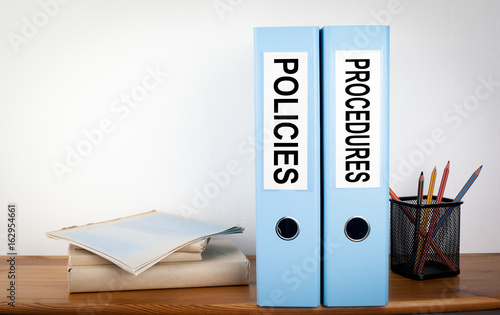 Vászonkép  Policies and Procedures binders in the office