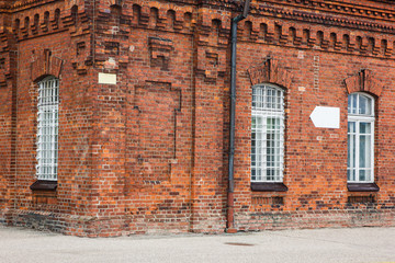 Old brick wall industrial factory building corner.