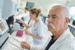 © auremar - microbiologist in office working on sample