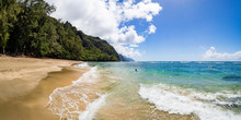 Panorama Of Tranquil Turquoise Waters Of Ke'e Beach With Lone Swimmer, Kauai, Hawaii