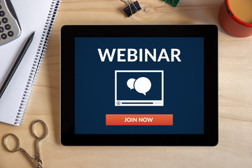 Wall Mural - webinar concept on tablet screen with office objects on wooden desk. all screen content is designed 