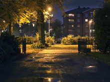 Suburban Area During Evening/night-time. Dark Setting With Some Lights