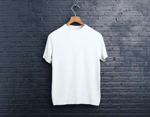 white t-shirt on brick background