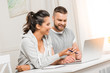 © LIGHTFIELD STUDIOS - portrait of smiling couple discussing project while working at home together