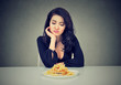 Sad woman on diet craving for fast food