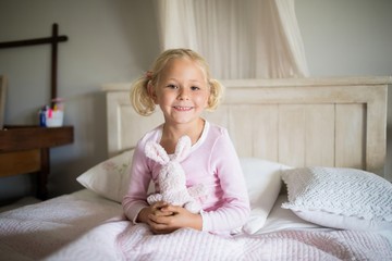 Wall Mural - Girl relaxing on bed in the bedroom at home