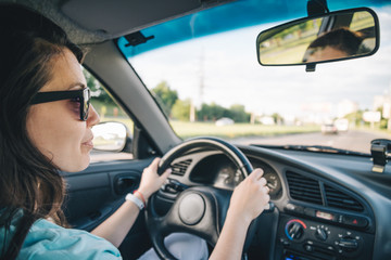 young woman driving car