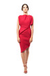 © sharplaninac - Walking young elegant woman in red evening dress looking at camera.  Full body length portrait isolated on white studio background.