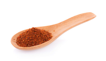 Wall Mural - Pile of red paprika powder on spoon wooden