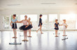 © Flamingo Images - Group of little girls practicing in ballet class