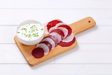 Poster - white yogurt with slices of beetroot and white radish