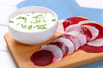 Poster - white yogurt with slices of beetroot and white radish