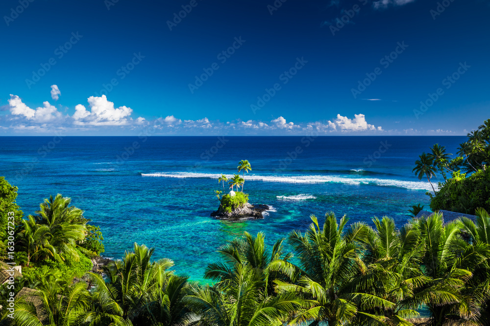 Tropical beach on Samoa Island with palm trees on small island, Upolu - obrazy, fototapety, plakaty 