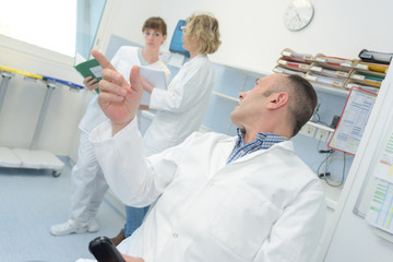 Wall Mural - doctor talking to nurses