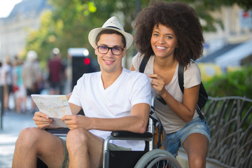 man in wheelchair and girlfriend on holidays