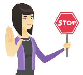 Poster - Asian business woman holding stop road sign