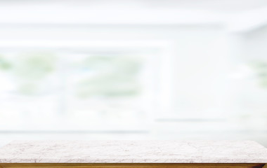 White marble table top on blur kitchen window background.