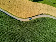 Aerial View Of Road Through Fields