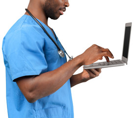 Wall Mural - Friendly Afro-American doctor working on a laptop