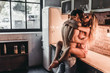 Leinwanddruck Bild - Couple on kitchen
