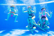 © yanlev - little kids swimming  in pool  underwater.