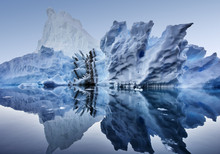 Iceberg Floating In Greenland Fjord