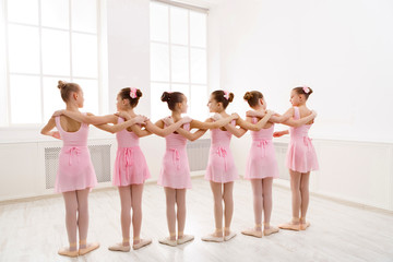 Little girls dancing ballet in studio