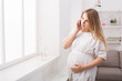 © Prostock-studio - Young pregnant woman talking on her smartphone