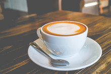 Hot Coffee Mocha With Foam Milk In Vintage Cafe(vintage Effect)