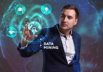 Business, Technology, Internet and network concept. Young businessman working on a virtual screen of the future and sees the inscription: Data mining