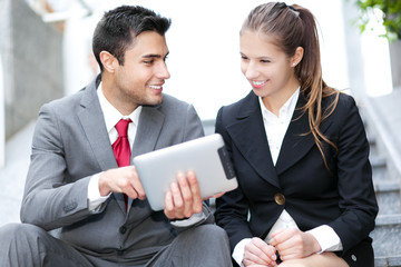 Wall Mural - Business people using a digital tablet