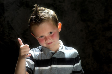 young boy posing in the studio 